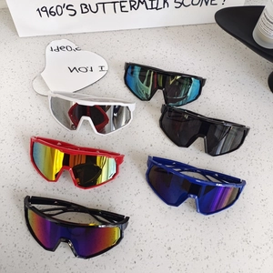 Flat lay of colorful children's oversized sports sunglasses for cycling and protection