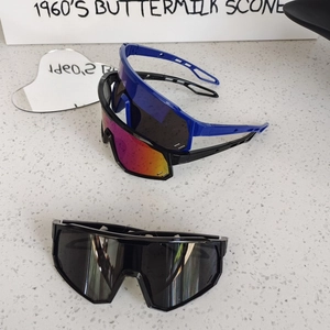 Close-up of kids sports sunglasses with aerodynamic frame and colorful gradient lenses