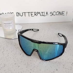 Close-up of sporty kids cycling sunglasses with colorful mirrored lenses and black frames
