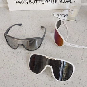 Kids sports sunglasses with large frame and wrap shield design for outdoor cycling
