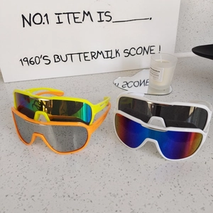 Kids sports sunglasses with colorful mirrored lenses and vibrant frames for outdoor activities