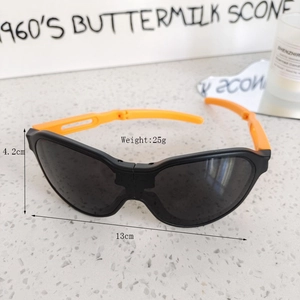 Detail view of folding kids sunglasses with orange arms and weight dimensions