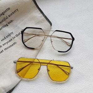 Modern double bridge oversized geometric sunglasses featuring metal and transparent frames