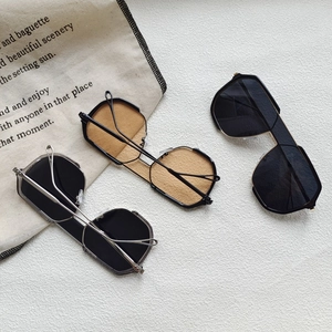 Three pairs of oversized polygonal sunglasses in gray and brown with double bridge frames
