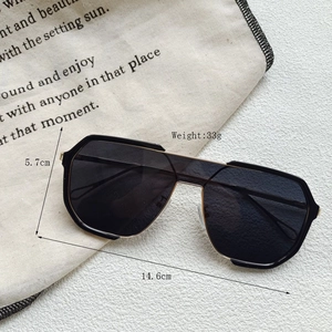 Detailed dimensions of oversized aviator sunglasses with gold metal frame and dimensions