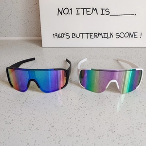 Detail view of colorful gradient lenses on sporty windproof hiking sunglasses