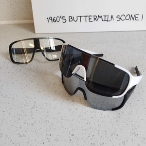 Close-up of three sports sunglasses featuring wrap-around lenses and anti-slip frames