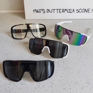 Selection of four colored shield sunglasses for hiking and cycling with UV protection