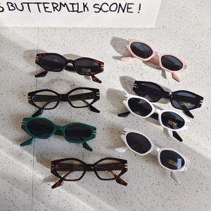 Retro oval kids UV400 sunglasses in various colors on a stylish terrazzo background