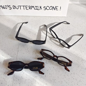 Detail of vintage oval kids sunglasses with UV400 protection and tortoise shell frames