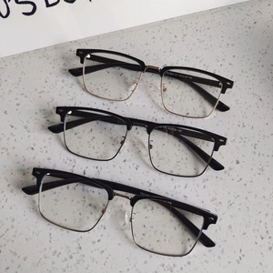 Three classic half-frame blue light blocking glasses in black gold, black silver, and solid black