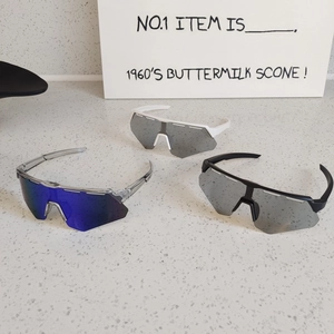 Three pairs of oversized sports cycling sunglasses with UV protection in various colors