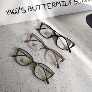 Three cat-eye glasses frames in black, purple pink, and green with blue light lenses
