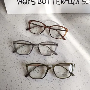 Detailed flat lay of cat-eye anti-blue light glasses frames in multiple transparent colors