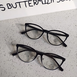 Detail view of vintage cat-eye anti-blue light glasses frames in black and gradient grey