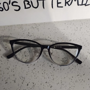 Detailed close-up of gradient black frame eyeglasses with anti-blue light functional lenses