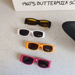 Kids rectangular sunglasses in black, white, orange, and pink with UV400 protection
