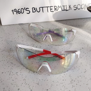 Top view of two white semi-rimless cycling glasses with colorful photochromic lenses
