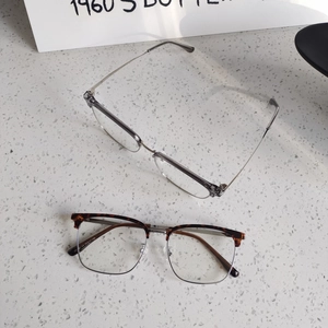 Close-up of semi-rimless anti-blue light glasses showing size specs on the temples