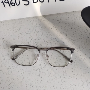 Close-up of semi-rimless anti-blue light glasses with transparent grey browline frame
