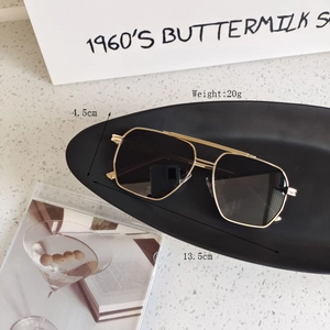 Detail view of gold aviator sunglasses showing 13.5cm frame width and 20g lightweight