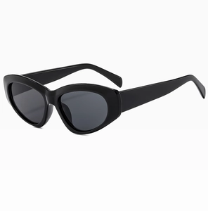 Side view of trendy black cat-eye sunglasses with thick glossy frames and dark grey lenses
