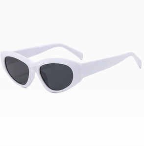 Detail view of stylish white cat-eye sunglasses with premium black UV-protective lenses