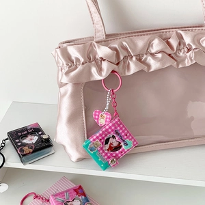 Pink satin ita bag featuring ruffled edges with photo card holders and mini album charms