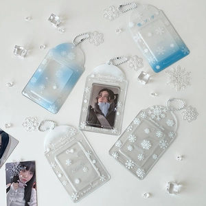 Close-up of winter snowflake card holders with bead chains and acrylic pendants