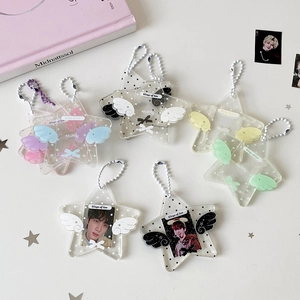 Detail of star-shaped acrylic photo card holders with colorful wings and bead chains