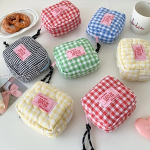 Quilted checkered cotton cosmetic bags in assorted colors with zip closure and tags