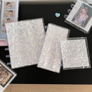 Three sizes of water ripple textured binders for photocard storage and organization