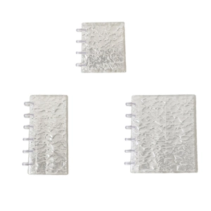 Set of three transparent water ripple binders in various sizes with disc-bound design