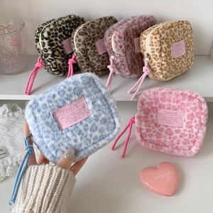Mini leopard plush makeup pouches with zip closure and fabric label for daily storage