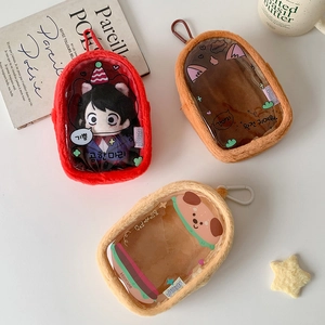 Macro view of plush doll storage bags with clear windows in red, brown and yellow