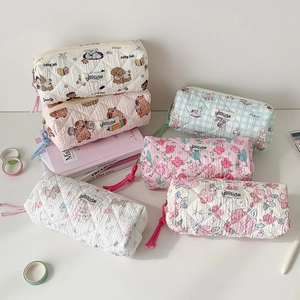 Quilted cotton pencil cases in various patterns like capybara and floral prints