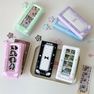 Detail of Korean-style star photo album featuring colorful covers and star-shaped charms