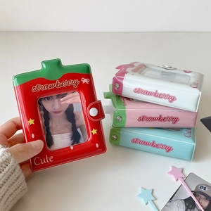 Detail of strawberry photocard binder showing snap button closure and transparent window