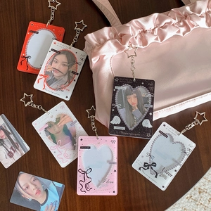 Detailed view of colorful acrylic photocard holders with star-shaped keychains
