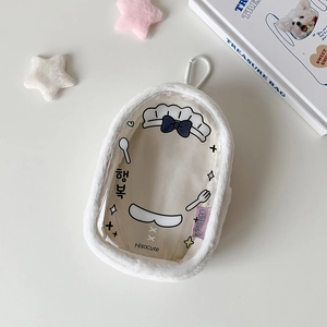 Close-up of white plush mini display bag with transparent window and cartoon chef print