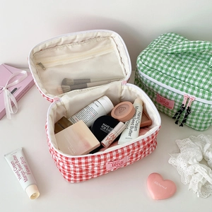 Quilted checkerboard makeup bags in red and green with top zipper and inner mesh pocket
