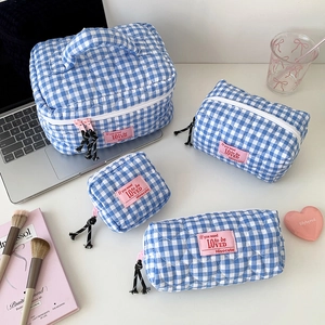 Blue plaid quilted cosmetic bag set including tote and pouches with heart embroidery