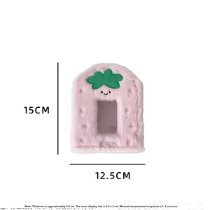 Close-up of strawberry plush photocard holder with window and Luck embroidery