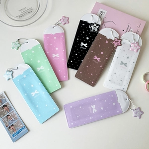Close-up of colorful PVC photo card holders with star charms in seven vibrant colors