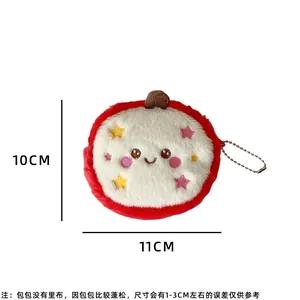 Detail of dragon fruit plush coin purse with embroidery and metal ball chain strap