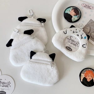 Detail of plush cartoon puppy card holder with clear window and metal clip attachment