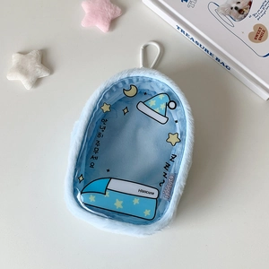 Macro detail of blue plush doll storage bag with transparent PVC window and star moon print