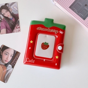 Close-up of strawberry themed photocard binder with snap button and PVC glossy texture