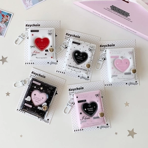 Close-up of heart-shaped PVC photo card keychains in assorted pastel colors