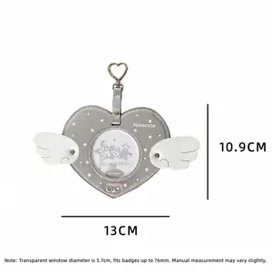 Detailed size specifications for a gray heart-shaped badge holder with white wings